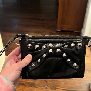 Beautiful soft leather Betsey Johnson wristlet with studded bow